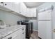 Bright laundry area offers modern washer/dryer, sleek countertops, and ample cabinet space for storage at 3812 N Barron --, Mesa, AZ 85207