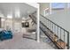 Comfortable living room with modern staircase, recessed lighting, and access to outdoor patio at 3812 N Barron --, Mesa, AZ 85207