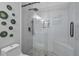 Contemporary walk-in shower features sleek glass enclosure, rainfall shower head, and stylish herringbone tile at 3812 N Barron --, Mesa, AZ 85207