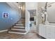 Stairway leading to an upper floor, with a view into a living room at 3812 N Barron --, Mesa, AZ 85207