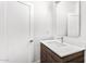 Modern bathroom featuring a sleek vanity, a large mirror, and a bright white interior with stylish fixtures at 4220 N 32Nd St # 2, Phoenix, AZ 85018