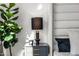 Tastefully decorated bedroom nightstand with a modern lamp, candle and small houseplant on top at 4220 N 32Nd St # 2, Phoenix, AZ 85018