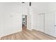 This bright bedroom features modern flooring, a ceiling fan and a closet at 4220 N 32Nd St # 2, Phoenix, AZ 85018
