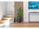 Modern stairway with light wood steps and accent wall with interesting decor at 4220 N 32Nd St # 2, Phoenix, AZ 85018