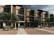 Modern townhome exterior showcasing a sleek design with contemporary finishes and drought-tolerant landscaping at 4220 N 32Nd St # 2, Phoenix, AZ 85018