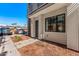 Front exterior of a modern townhome with a sleek design, desert landscaping, and convenient parking at 4220 N 32Nd St # 2, Phoenix, AZ 85018