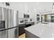 Stylish kitchen with stainless steel appliances, white cabinets, and a bright, airy atmosphere at 4220 N 32Nd St # 2, Phoenix, AZ 85018