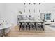 Modern kitchen features a large island with seating, stainless steel appliances, and light wood flooring at 4220 N 32Nd St # 2, Phoenix, AZ 85018