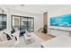 Bright living room with a modern sofa, stylish decor, and a sliding glass door at 4220 N 32Nd St # 2, Phoenix, AZ 85018