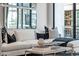 Stylish living room featuring a plush white couch, patterned pillows, and a marble coffee table, perfect for relaxation and style at 4220 N 32Nd St # 2, Phoenix, AZ 85018