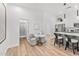 Bright living space showcasing a dining area, open kitchen, and adjacent bathroom, perfect for modern living at 4220 N 32Nd St # 2, Phoenix, AZ 85018
