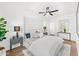 Spacious main bedroom featuring modern furnishings, a ceiling fan and stylish decor at 4220 N 32Nd St # 2, Phoenix, AZ 85018