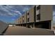 Modern townhome exterior featuring private garages, with plenty of parking, and desert-friendly landscaping at 4220 N 32Nd St # 2, Phoenix, AZ 85018