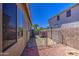 Enclosed backyard featuring gravel landscaping and secure fencing, perfect for pets and privacy at 43302 W Bunker Dr, Maricopa, AZ 85138