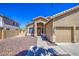 Charming single-story home with a well-maintained front yard and a two-car garage at 43302 W Bunker Dr, Maricopa, AZ 85138