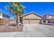 Charming single-story home with a three car garage, palm tree, and a well maintained front yard at 43302 W Bunker Dr, Maricopa, AZ 85138