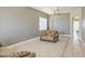 Inviting living room with tile flooring, a ceiling fan, and a neutral color palette at 43302 W Bunker Dr, Maricopa, AZ 85138