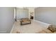 Spacious living room with tile flooring and a comfortable seating area, with neutral color palette at 43302 W Bunker Dr, Maricopa, AZ 85138