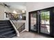 Inviting entryway with stairs, modern flooring, and elegant iron railing at 4502 W Greenway Rd, Glendale, AZ 85306