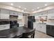 Well-lit kitchen with white cabinetry, stainless steel appliances, and sleek countertops at 4502 W Greenway Rd, Glendale, AZ 85306
