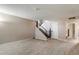 Spacious living room features a staircase and tile flooring and ample space for entertaining at 4502 W Greenway Rd, Glendale, AZ 85306