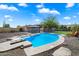 Beautiful in-ground pool with diving board and lounge chairs, ideal for summer relaxation at 4502 W Greenway Rd, Glendale, AZ 85306