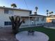 Spacious backyard featuring artificial turf, a fire pit, and mature trees at 4517 S Grandview Ave, Tempe, AZ 85282