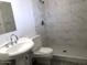 Modern bathroom features stylish marble tiling in the shower and a pedestal sink at 4517 S Grandview Ave, Tempe, AZ 85282