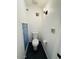 Bright bathroom with toilet and uniquely framed window at 4517 S Grandview Ave, Tempe, AZ 85282