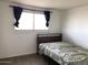 Cozy bedroom with a single bed and a large window for plenty of light at 4517 S Grandview Ave, Tempe, AZ 85282