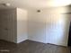 Bedroom with wood-look floors and a double door closet at 4517 S Grandview Ave, Tempe, AZ 85282