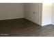 Bedroom with modern wood-look floors and a closed closet at 4517 S Grandview Ave, Tempe, AZ 85282