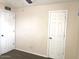 Bright bedroom with two doors leading to other rooms at 4517 S Grandview Ave, Tempe, AZ 85282