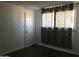 Bedroom with a window with curtains and wood-look floors at 4517 S Grandview Ave, Tempe, AZ 85282