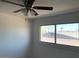 Bright bedroom with a ceiling fan and large window with a view at 4517 S Grandview Ave, Tempe, AZ 85282