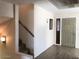 Inviting entryway with staircase, stylish front door and wood-look flooring at 4517 S Grandview Ave, Tempe, AZ 85282