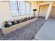 Home exterior with a flower bed featuring colorful flowers and a porch at 4517 S Grandview Ave, Tempe, AZ 85282