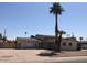 Charming single-story home featuring a lush palm tree and an expansive driveway for ample parking at 4517 S Grandview Ave, Tempe, AZ 85282