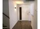 Entry hallway featuring stairs, wood flooring, light fixtures, and a front door at 4517 S Grandview Ave, Tempe, AZ 85282