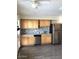 Well-lit kitchen with wooden cabinets, stainless steel appliances, and modern backsplash at 4517 S Grandview Ave, Tempe, AZ 85282
