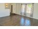 Open living room showcasing wood-look flooring, neutral paint, and large windows at 4517 S Grandview Ave, Tempe, AZ 85282