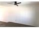 Bright living room featuring sleek flooring and a modern ceiling fan at 4517 S Grandview Ave, Tempe, AZ 85282