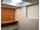 Bright living room with built-in shelving, desk and ample natural light at 4517 S Grandview Ave, Tempe, AZ 85282