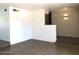 Spacious open-concept living area with tiled floors leading to the kitchen at 4517 S Grandview Ave, Tempe, AZ 85282