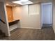 Inviting living room with wood-style flooring and a built-in desk area at 4517 S Grandview Ave, Tempe, AZ 85282