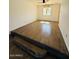 Open-concept living space featuring a large window with a view and wood look floors at 4517 S Grandview Ave, Tempe, AZ 85282