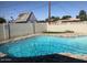 Backyard pool has a concrete block fence, rock border and artificial turf at 4517 S Grandview Ave, Tempe, AZ 85282