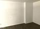 Neutral room with dark, wood-style flooring and white walls at 4517 S Grandview Ave, Tempe, AZ 85282