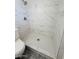 Bathroom with tiled shower and toilet, featuring chrome fixtures at 4517 S Grandview Ave, Tempe, AZ 85282