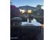 Outdoor cooking station with a granite bar and an umbrella for shade, ideal for entertaining guests at 5018 E Kathleen Rd, Scottsdale, AZ 85254